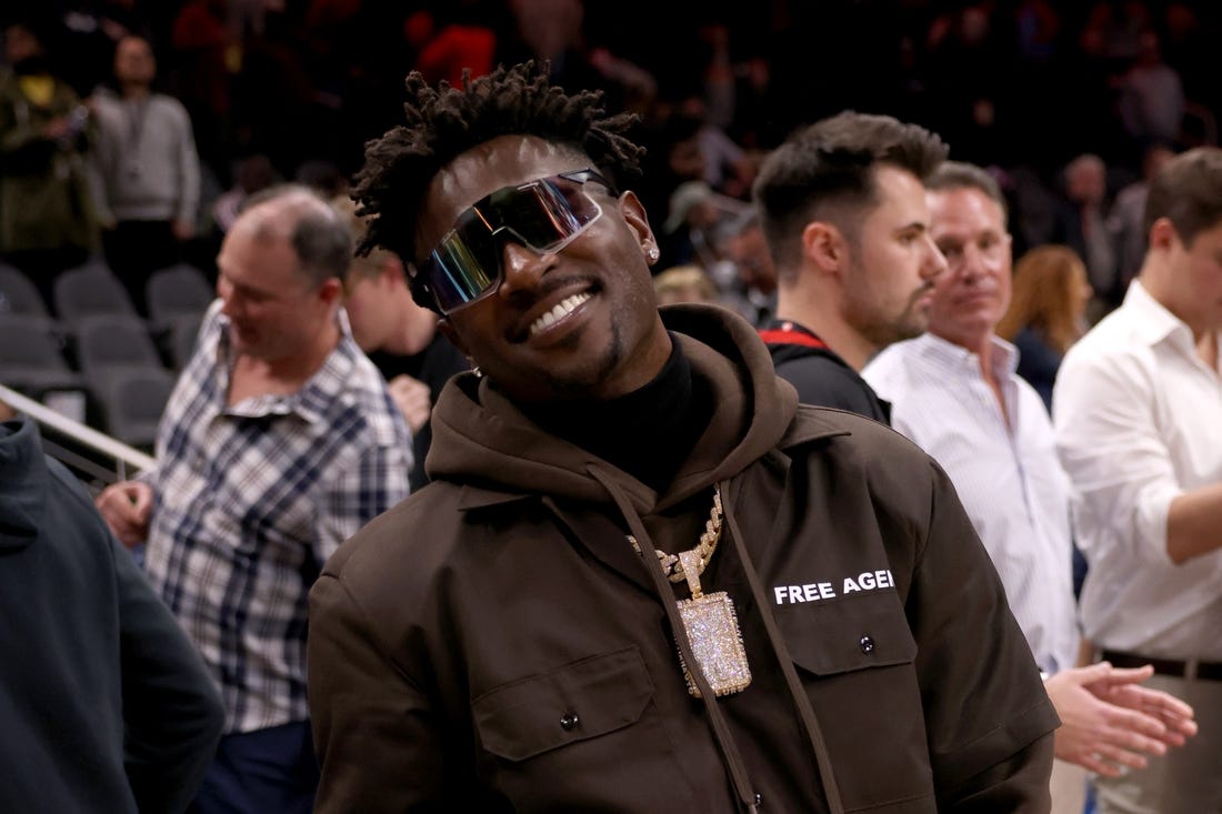 Mar 11, 2022; Atlanta, Georgia, USA; Former Tampa Bay Buccaneers wide receiver Antonio Brown poses for photographers after the game between the Atlanta Hawks and the LA Clippers at State Farm Arena. Mandatory Credit: Jason Getz-USA TODAY Sports