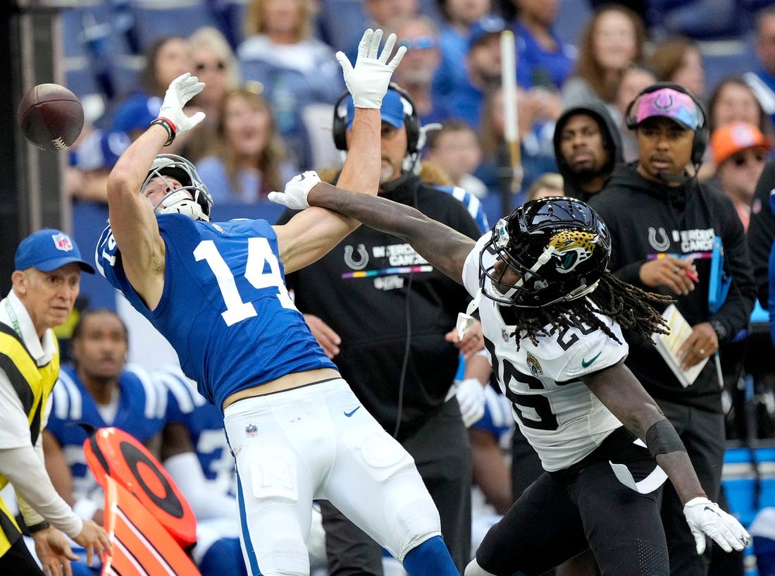 Jacksonville Jaguars cornerback Shaquill Griffin (26) applies pressure as a pass intended for Indianapolis Colts wide receiver Alec Pierce (14) goes incomplete Sunday, Oct. 16, 2022, during a game against the Jacksonville Jaguars at Lucas Oil Stadium in Indianapolis.