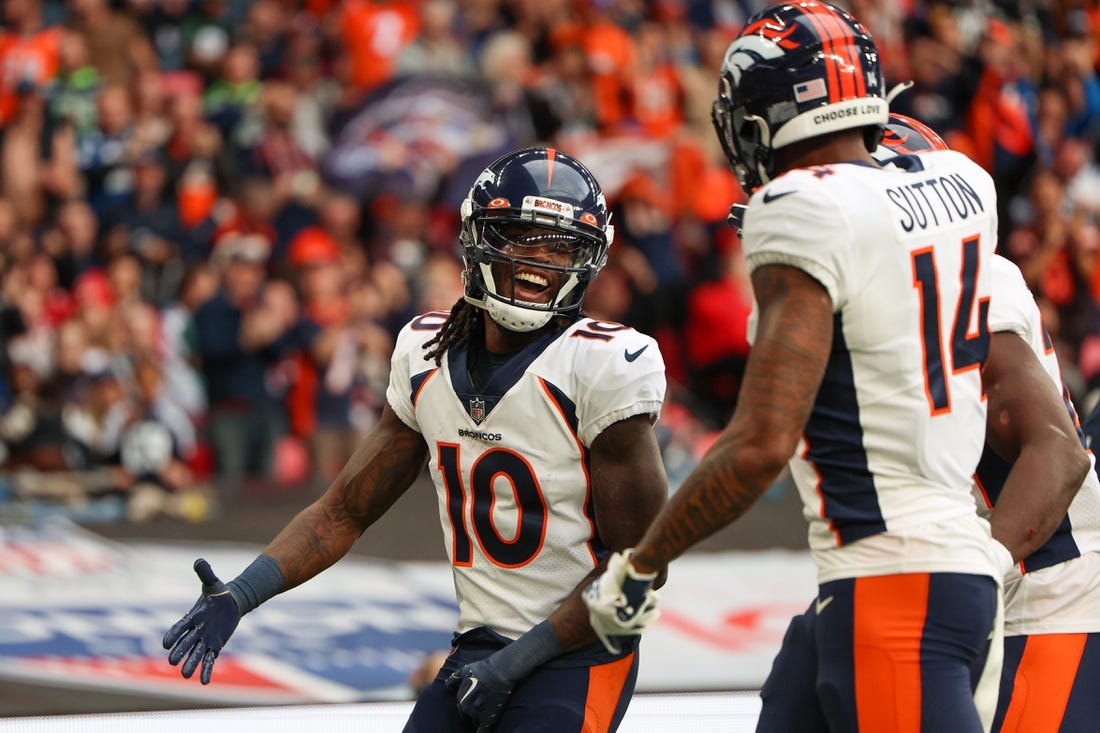 Oct 30, 2022; London, United Kingdom, Denver Broncos wide receiver Jerry Jeudy (10) is congratulated by wide receiver Courtland Sutton (14) after scoring a touchdown against the Jacksonville Jaguars in the second quarter during an NFL International Series game at Wembley Stadium. Mandatory Credit: Nathan Ray Seebeck-USA TODAY Sports