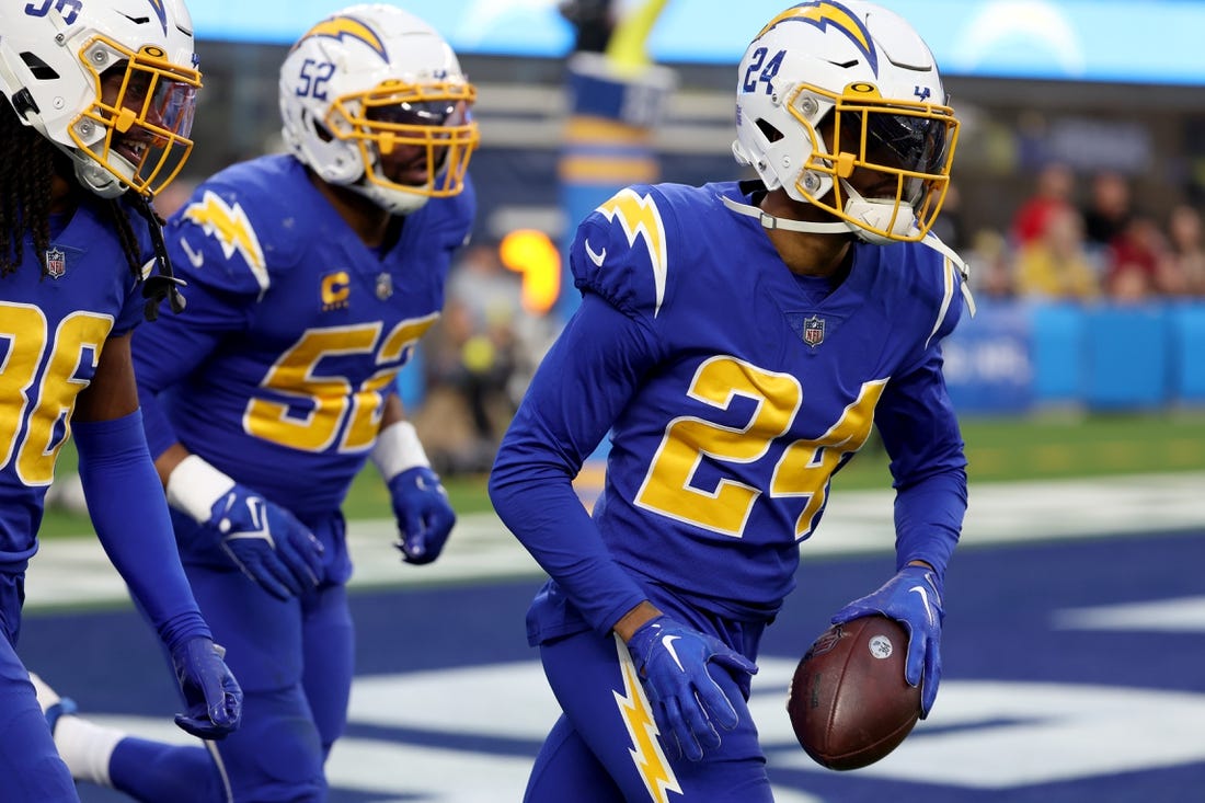 Dec 18, 2022; Inglewood, California, USA; Los Angeles Chargers safety Nasir Adderley (24) reacts after intercepting a pass during the third quarter against the Tennessee Titans at SoFi Stadium. Mandatory Credit: Kiyoshi Mio-USA TODAY Sports