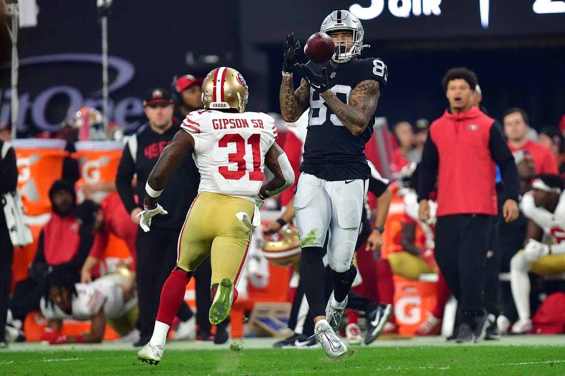 January 1, 2023; Paradise, Nevada, USA; Las Vegas Raiders tight end Darren Waller (83) catches a pass against San Francisco 49ers safety Tashaun Gipson Sr. (31) during the second half at Allegiant Stadium. Mandatory Credit: Gary A. Vasquez-USA TODAY Sports