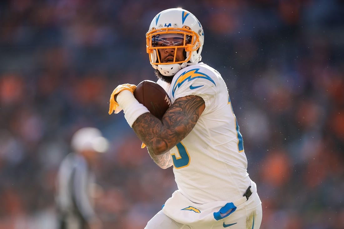 Jan 8, 2023; Denver, Colorado, USA; Los Angeles Chargers wide receiver Keenan Allen (13) catches the ball and runs for a touchdown in the first quarter against the Denver Broncos at Empower Field at Mile High. Mandatory Credit: Isaiah J. Downing-USA TODAY Sports