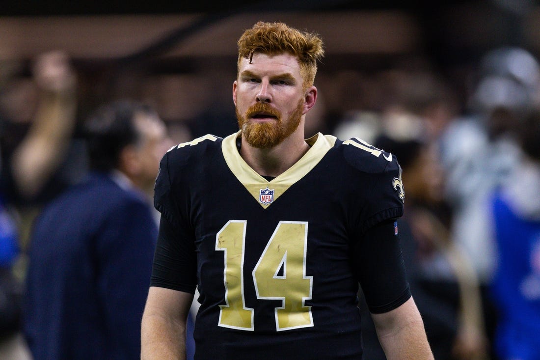 Jan 8, 2023; New Orleans, Louisiana, USA;  New Orleans Saints quarterback Andy Dalton (14) runs to the locker room after the game against the Carolina Panthers during the second half at Caesars Superdome. Mandatory Credit: Stephen Lew-USA TODAY Sports
