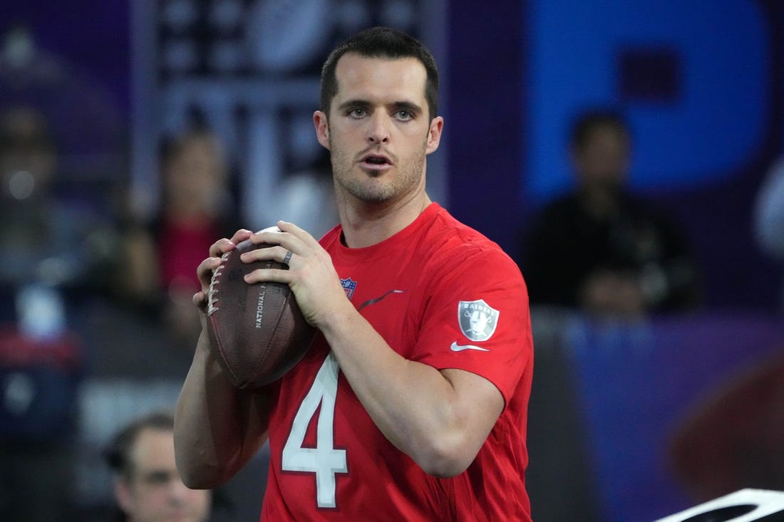 Feb 2, 2023; Henderson, NV, USA; Las Vegas Raiders quarterback Derek Carr (4) throws the ball during the Pro Bowl Skills competition at the Intermountain Healthcare Performance Facility. Mandatory Credit: Kirby Lee-USA TODAY Sports