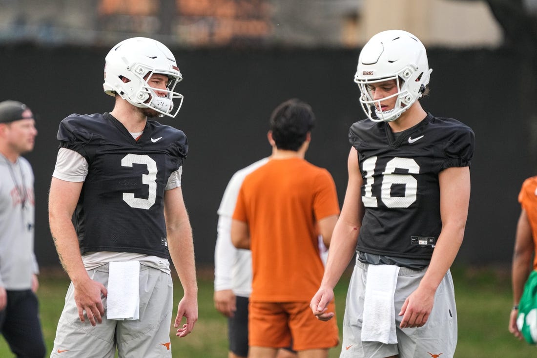 Quarterbacks Quinn Ewers (3) and Arch Manning (16) talk during the first Texas Longhorns football practice of 2023 at the Frank Denius Fields on the University of Texas at Austin campus on Monday, March 6, 2023.

Aem Texfoot First 2023 Practice 14