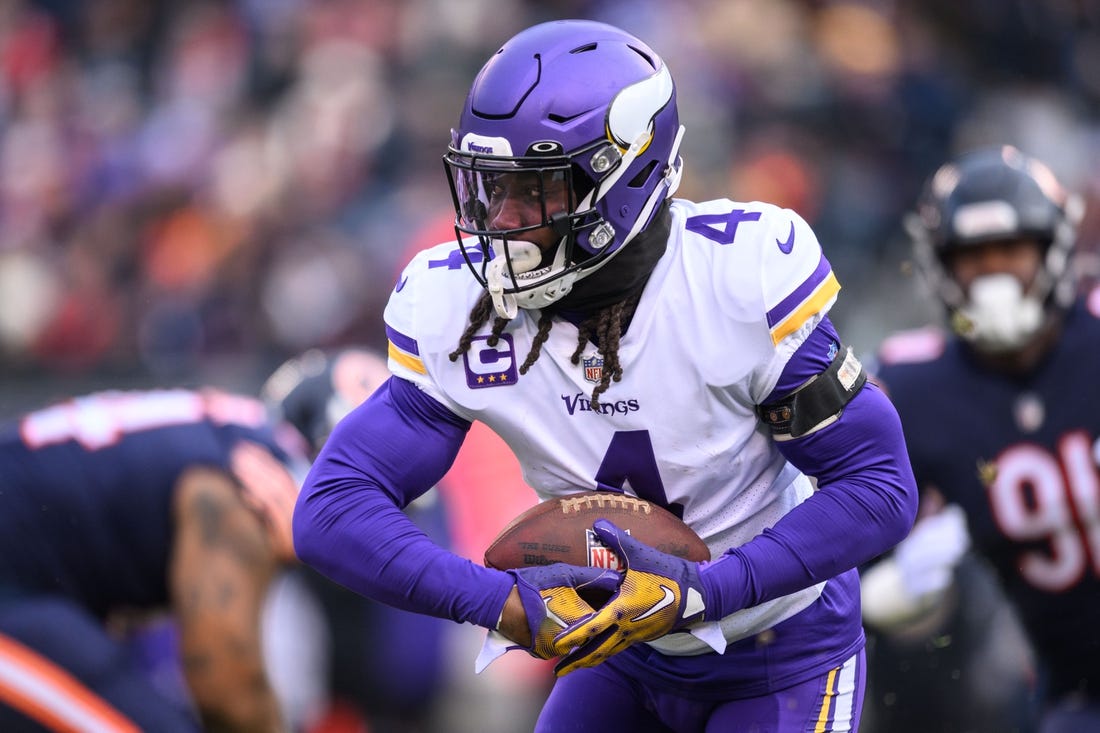 Jan 8, 2023; Chicago, Illinois, USA; Minnesota Vikings running back Dalvin Cook (4) runs the ball during the first quarter against the Chicago Bears at Soldier Field. Mandatory Credit: Daniel Bartel-USA TODAY Sports