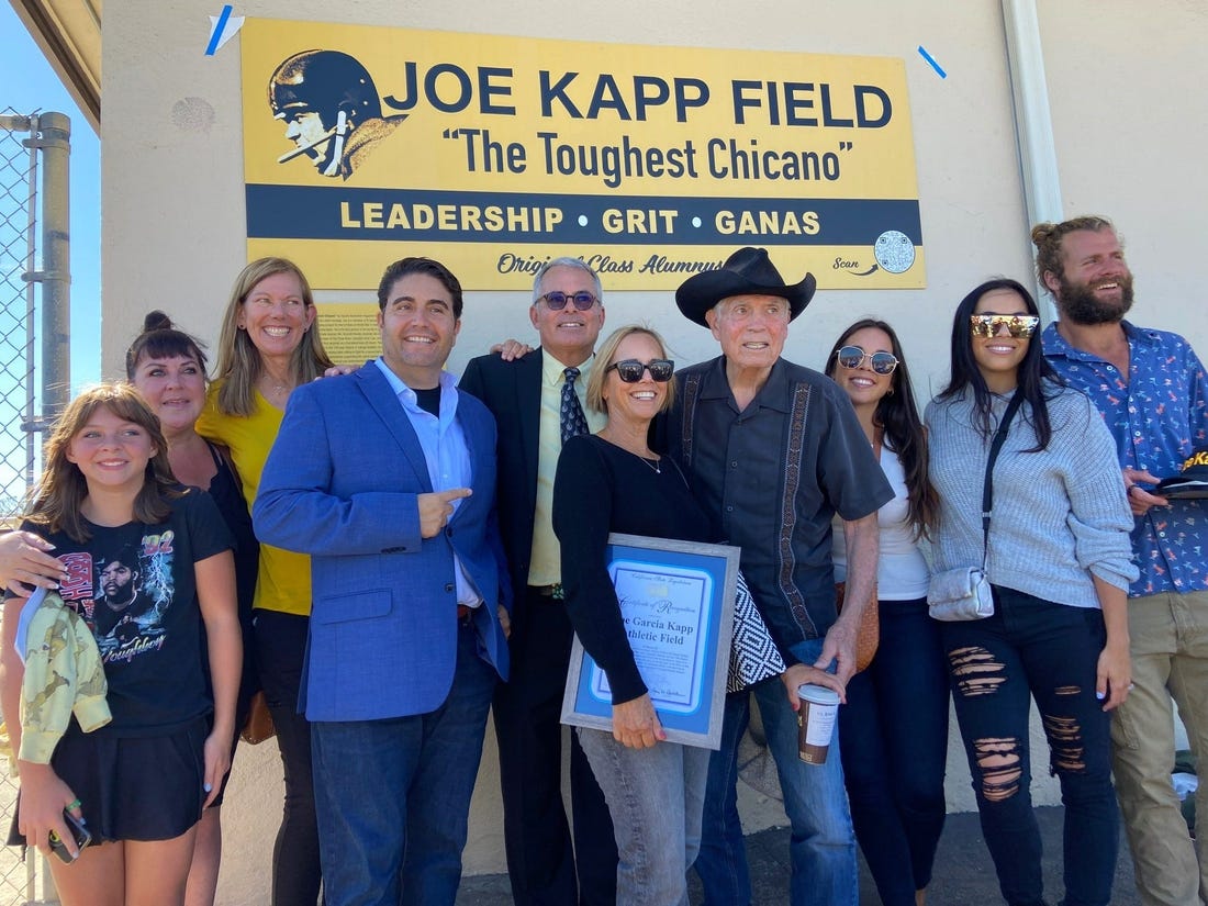 Joe Kapp and his family gather by a field sign created to honor the former NFL player's legacy at El Sausal Middle School in Salinas, Calif.

Jkappfamily