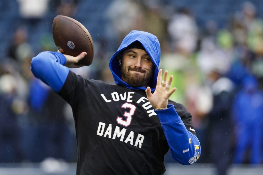 Jan 8, 2023; Seattle, Washington, USA; Los Angeles Rams quarterback Baker Mayfield (17) participates in early pregame warmups against the Seattle Seahawks while wearing a    Love for Damar    t-shirt in honor of Buffalo Bills safety Damar Hamlin (3, not pictured) at Lumen Field. Mandatory Credit: Joe Nicholson-USA TODAY Sports