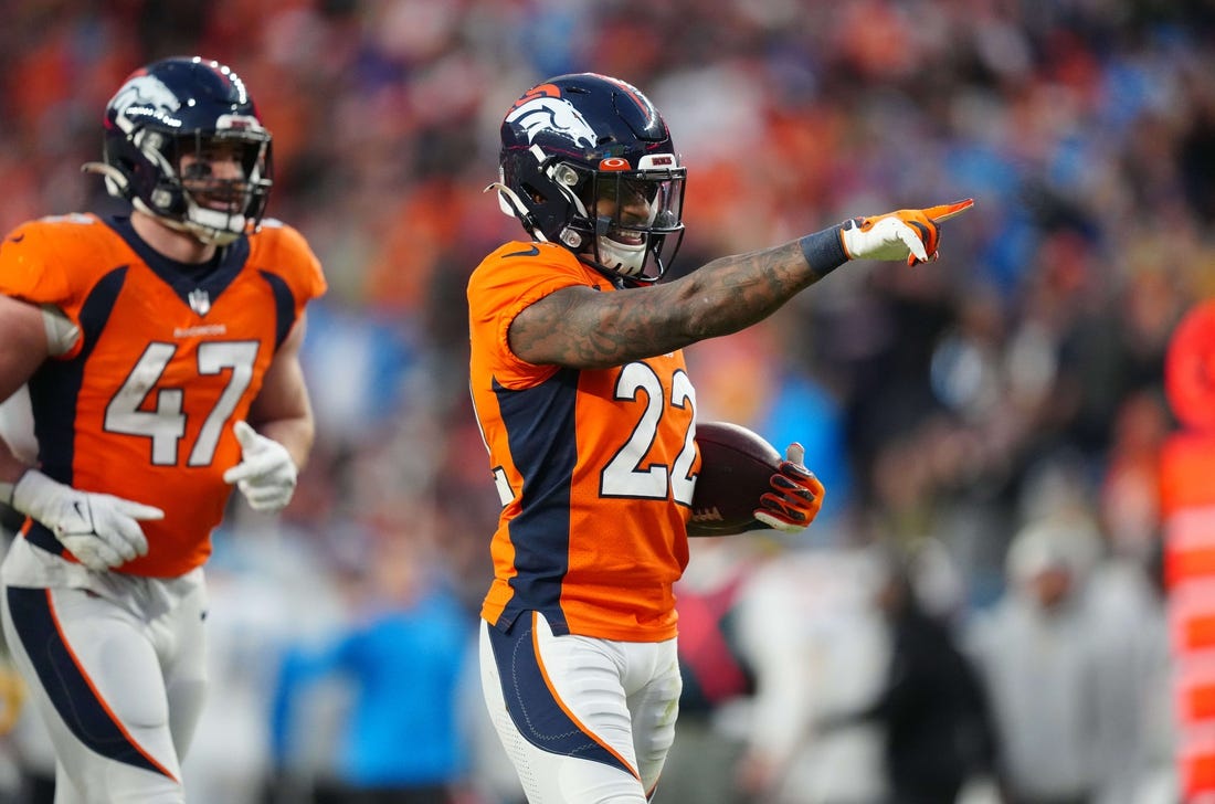 Jan 8, 2023; Denver, Colorado, USA; Denver Broncos safety Kareem Jackson (22) celebrates after recovering a fumble against the Denver Broncos in the fourth quarter at Empower Field at Mile High. Mandatory Credit: Ron Chenoy-USA TODAY Sports