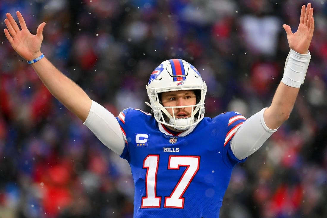 Jan 2, 2022; Orchard Park, New York, USA; Buffalo Bills quarterback Josh Allen (17) reacts to a touchdown against the Atlanta Falcons during the second half at Highmark Stadium. Mandatory Credit: Rich Barnes-USA TODAY Sports
