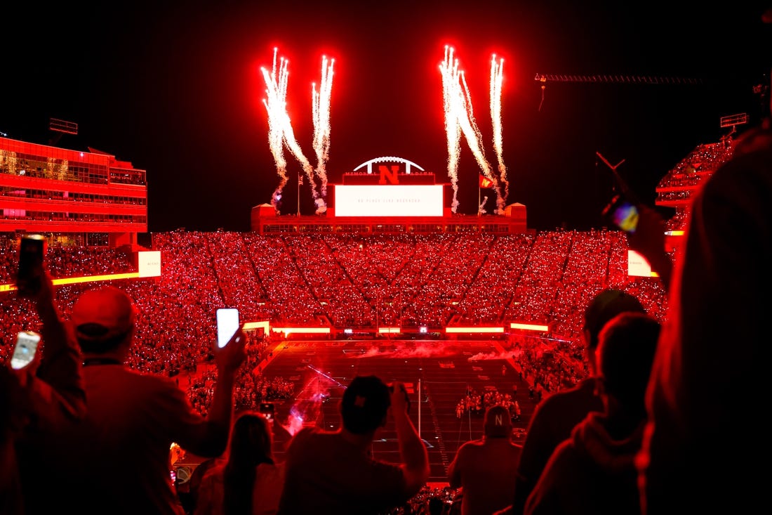 Oct 1, 2022; Lincoln, Nebraska, USA; Fans participate in a light show at the end of the third quarter between the Nebraska Cornhuskers and the Indiana Hoosiers at Memorial Stadium. Mandatory Credit: Dylan Widger-USA TODAY Sports