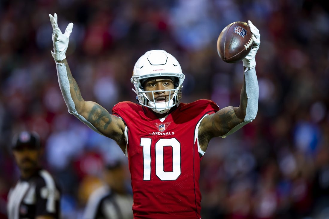 Nov 27, 2022; Glendale, Arizona, USA;  Arizona Cardinals wide receiver DeAndre Hopkins (10) celebrates after scoring a touchdown against the Los Angeles Chargers in the first half at State Farm Stadium. Mandatory Credit: Mark J. Rebilas-USA TODAY Sports