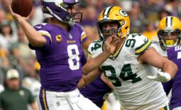 Green Bay Packers defensive end Dean Lowry (94) pressures Minnesota Vikings quarterback Kirk Cousins (8) during the first quarter of their game Sunday, September 11, 2022 at U.S. Bank Stadium in Minneapolis, Minn.Mjs Packers11 31 Jpg Packers11 114211850