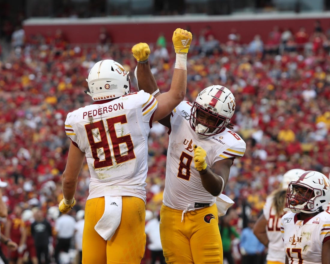 Sep 21, 2019; Ames, IA, USA; Louisiana Monroe Warhawks tight end Josh Pederson (86) and Louisiana Monroe Warhawks running back Josh Johnson (8) celebrate after a touchdown against the Iowa State Cyclones at Jack Trice Stadium. Mandatory Credit: Reese Strickland-USA TODAY Sports