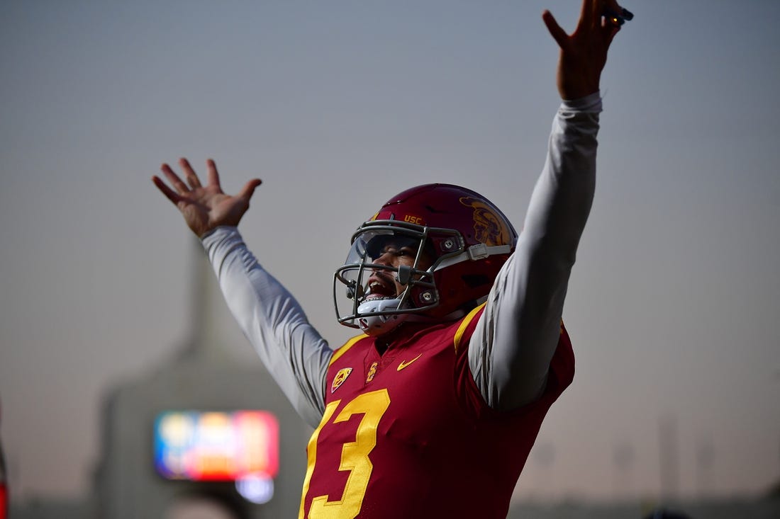 Southern California Trojans quarterback Caleb Williams (13) celebrates Tahj Washington (16) scoring a touchdown against the Notre Dame Fighting Irish during the first half at the Los Angeles Memorial Coliseum. Mandatory Credit: Gary A. Vasquez-USA TODAY Sports