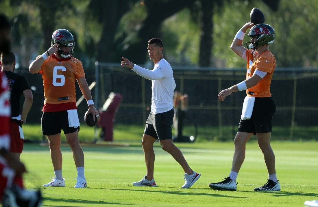 Jul 30, 2023; Tampa, FL, USA; Tampa Bay Buccaneers offensive coordinator Dave Canales talks with quarterback Baker Mayfield (6) and quarterback Kyle Trask (2) during training camp at AdventHealth Training Center. Mandatory Credit: Kim Klement-USA TODAY Sports