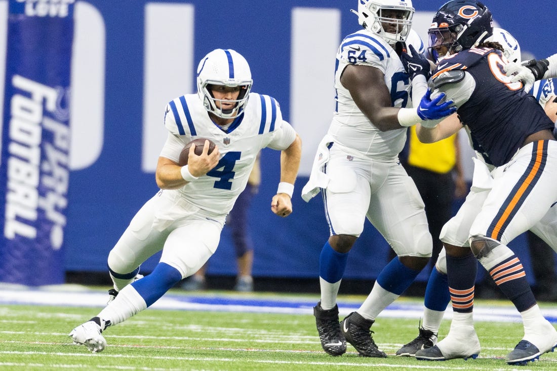 Aug 19, 2023; Indianapolis, Indiana, USA; Indianapolis Colts quarterback Sam Ehlinger (4) runs the ball in the second quarter against the Chicago Bears at Lucas Oil Stadium. Mandatory Credit: Trevor Ruszkowski-USA TODAY Sports