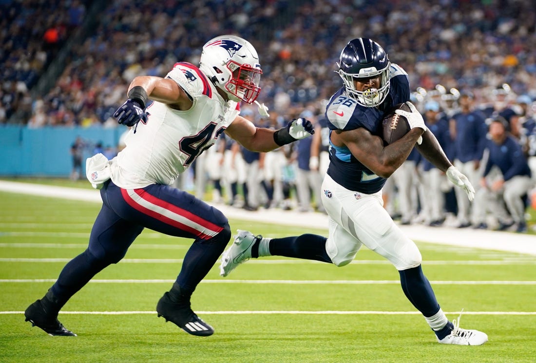 Tennessee Titans running back Julius Chestnut (36)scores a touchdown past New England Patriots linebacker Diego Fagot (42) during the second quarter at Nissan Stadium in Nashville, Tenn., Friday, Aug. 25, 2023.