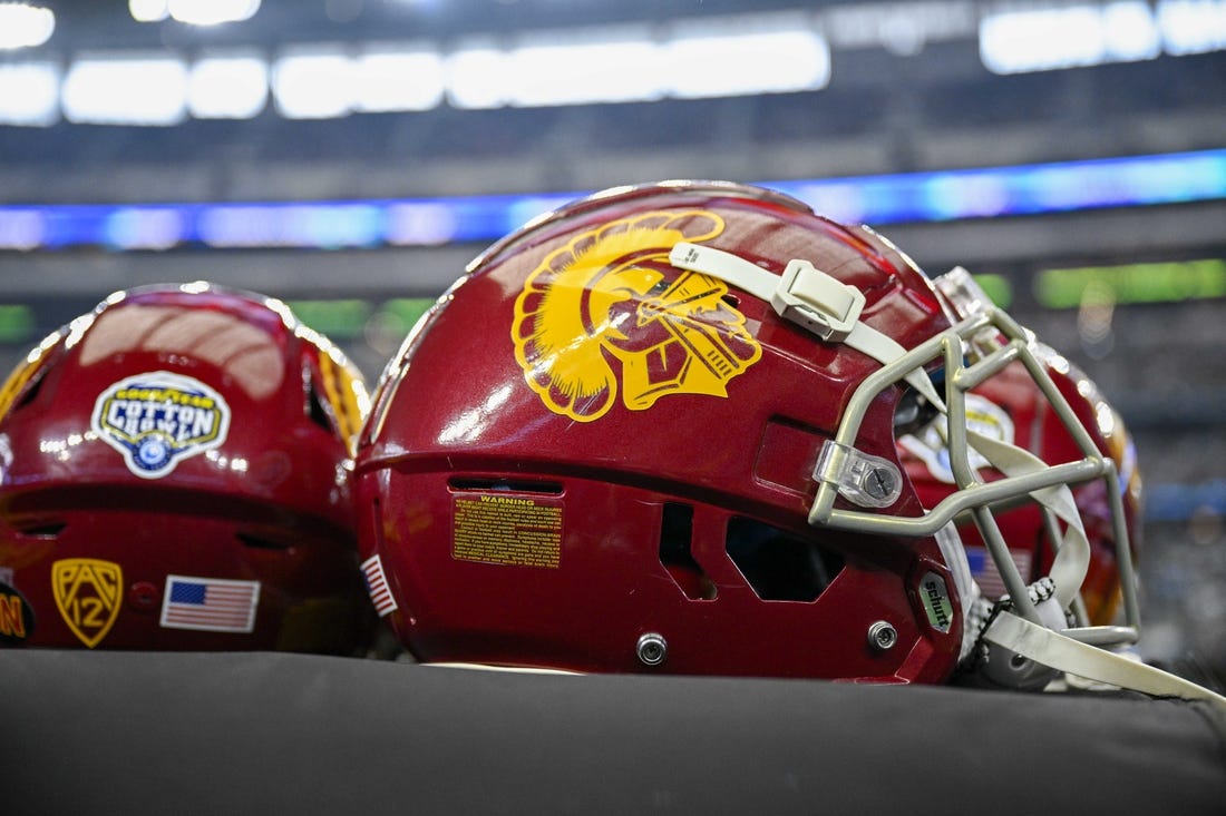 Jan 2, 2023; Arlington, Texas, USA; A view of the USC Trojans helmets and Cotton Bowl logo during the game between the USC Trojans and the Tulane Green Wave in the 2023 Cotton Bowl at AT&T Stadium. Mandatory Credit: Jerome Miron-USA TODAY Sports