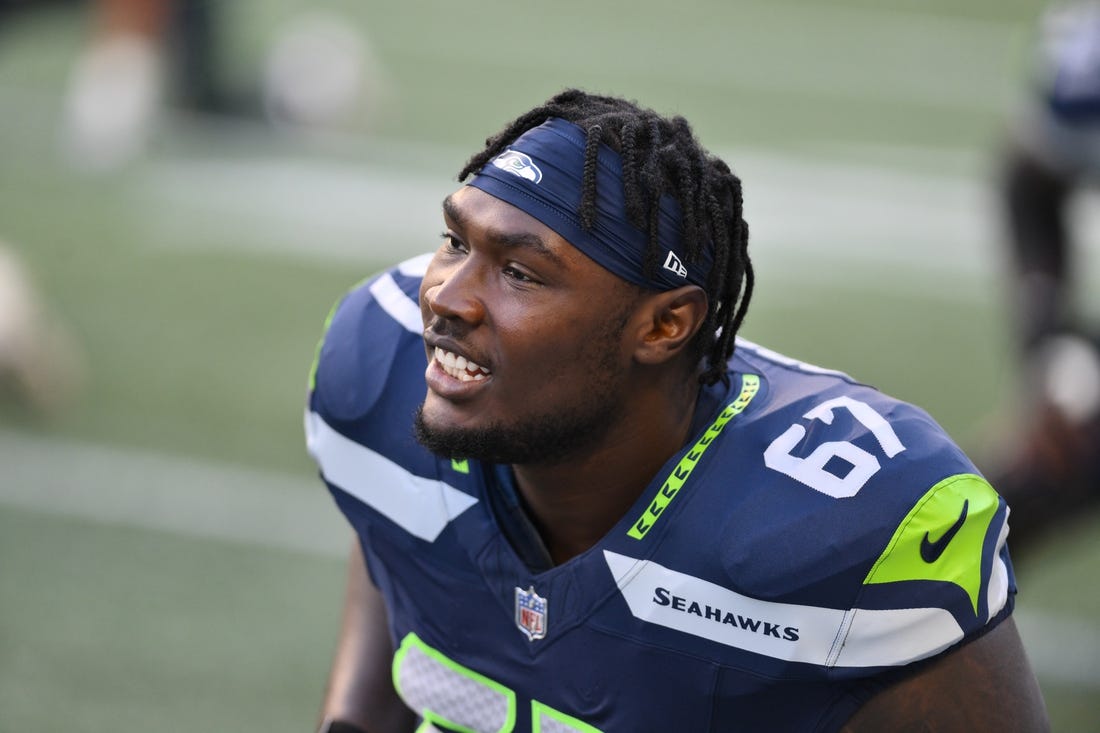 Aug 10, 2023; Seattle, Washington, USA; Seattle Seahawks offensive tackle Charles Cross (67) during warmups prior to the game at Lumen Field. Mandatory Credit: Steven Bisig-USA TODAY Sports