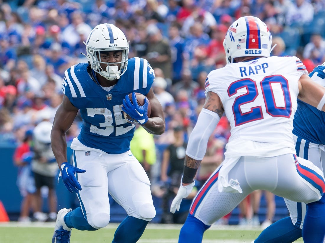 Aug 12, 2023; Orchard Park, New York, USA; Indianapolis Colts running back Deon Jackson (35) against Buffalo Bills safety Taylor Rapp (20) in the first quarter of a pre-season game at Highmark Stadium. Mandatory Credit: Mark Konezny-USA TODAY Sports