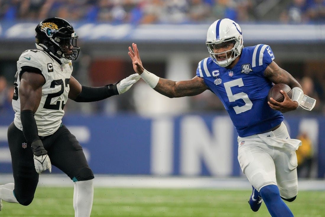 Jacksonville Jaguars linebacker Foyesade Oluokun (23) chases after Indianapolis Colts quarterback Anthony Richardson (5) as he rushes the ball Sunday, Sept. 10, 2023, during a game against the Jacksonville Jaguars at Lucas Oil Stadium in Indianapolis.