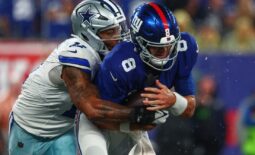 Sep 10, 2023; East Rutherford, New Jersey, USA; New York Giants quarterback Daniel Jones (8) is sacked by Dallas Cowboys linebacker Micah Parsons (11) during the first half at MetLife Stadium. Mandatory Credit: Ed Mulholland-USA TODAY Sports