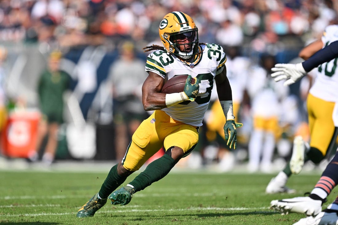 Sep 10, 2023; Chicago, Illinois, USA;  Green Bay Packers running back Aaron Jones (33) runs with the ball against the Chicago Bears at Soldier Field. Mandatory Credit: Jamie Sabau-USA TODAY Sports