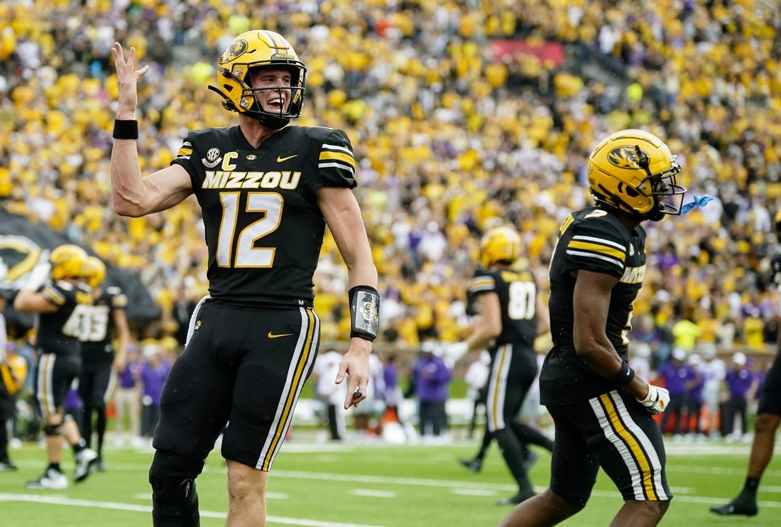 Sep 16, 2023; Columbia, Missouri, USA; Missouri Tigers quarterback Brady Cook (12) and wide receiver Luther Burden III (3) celebrate after a touchdown during the second half against the Kansas State Wildcats at Faurot Field at Memorial Stadium. Mandatory Credit: Jay Biggerstaff-USA TODAY Sports
