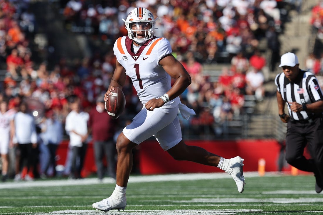 Sep 16, 2023; Piscataway, New Jersey, USA; Virginia Tech Hokies quarterback Kyron Drones (1) rolls out during the first half against the Rutgers Scarlet Knights at SHI Stadium. Mandatory Credit: Vincent Carchietta-USA TODAY Sports