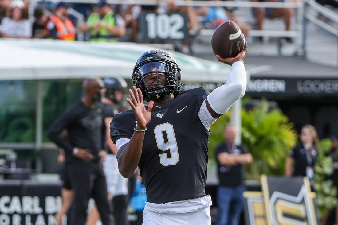 Sep 16, 2023; Orlando, Florida, USA; UCF Knights quarterback Timmy McClain (9) warms up before the game against the Villanova Wildcats at FBC Mortgage Stadium. Mandatory Credit: Mike Watters-USA TODAY Sports