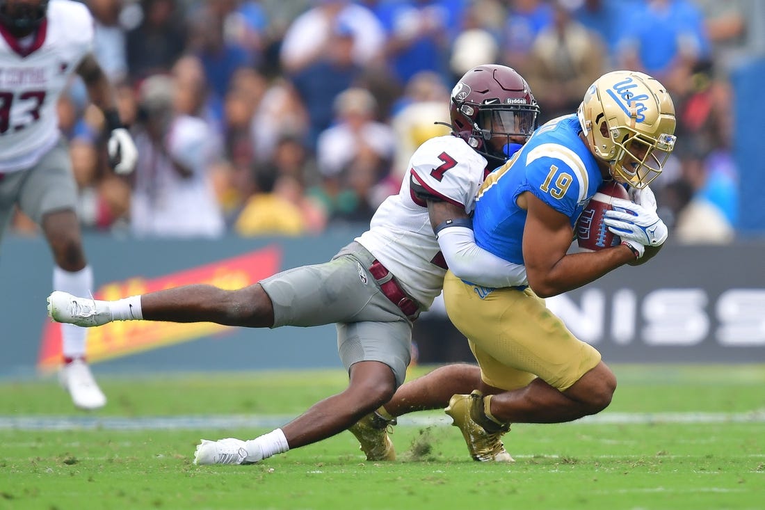 Sep 16, 2023; Pasadena, California, USA; UCLA Bruins wide receiver Kyle Ford (19) is brought down by North Carolina Central Eagles defensive back JaJuan Hudson (7) during the first half at Rose Bowl. Mandatory Credit: Gary A. Vasquez-USA TODAY Sports