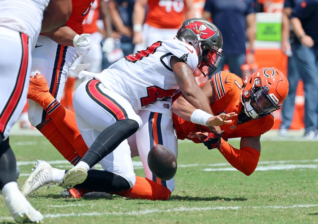 Sep 17, 2023; Tampa, Florida, USA; Tampa Bay Buccaneers linebacker Cam Gill (49) sacks Chicago Bears quarterback Justin Fields (1) to force a fumble during the second quarter at Raymond James Stadium. Mandatory Credit: Kim Klement Neitzel-USA TODAY Sports
