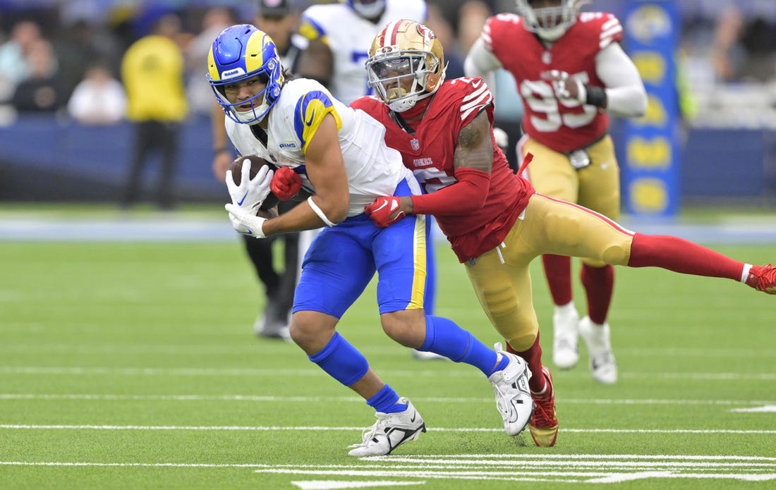 Sep 17, 2023; Inglewood, California, USA; Los Angeles Rams wide receiver Puka Nacua (17) is stopped by San Francisco 49ers cornerback Deommodore Lenoir (2) after a 32 yard pass play in the second half at SoFi Stadium. Mandatory Credit: Jayne Kamin-Oncea-USA TODAY Sports