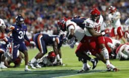 Sep 22, 2023; Charlottesville, Virginia, USA; North Carolina State Wolfpack running back Delbert Mimms III (34) scores a touchdown against the Virginia Cavaliers during the second quarter at Scott Stadium. Mandatory Credit: Geoff Burke-USA TODAY Sports