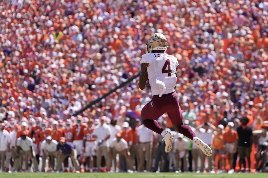 Sep 23, 2023; Clemson, South Carolina, USA; Florida State Seminoles wide receiver Keon Coleman (4) catches a touchdown pass in the first half against the Clemson Tigers at Memorial Stadium. Mandatory Credit: David Yeazell-USA TODAY Sports