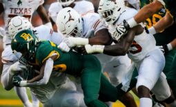 The Texas Longhorns defense stop DUPLICATE***Baylor running back Richard Reese (29) from advancing in the first quarter of the game, Saturday, Sept. 23 at McLane Stadium in Waco.