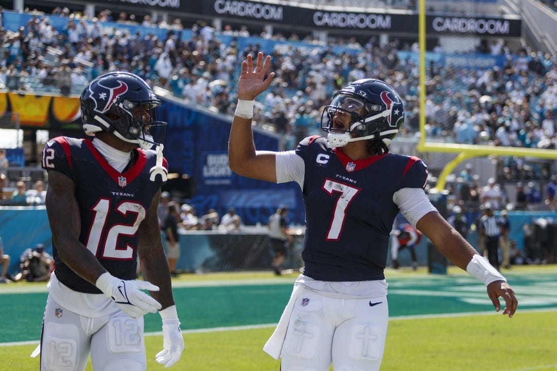 Sep 24, 2023; Jacksonville, Florida, USA; Houston Texans quarterback C.J. Stroud (7) and wide receiver Nico Collins (12) celebrate after a touchdown against Jacksonville Jaguars during the fourth quarter at EverBank Stadium. Mandatory Credit: Morgan Tencza-USA TODAY Sports
