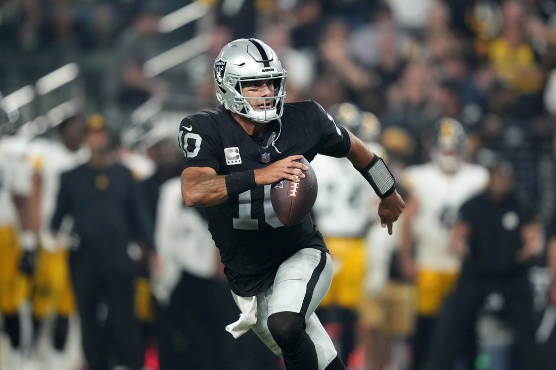 Sep 24, 2023; Paradise, Nevada, USA; Las Vegas Raiders quarterback Jimmy Garoppolo (10) throws the ball against the Pittsburgh Steelers in the second half at Allegiant Stadium. Mandatory Credit: Kirby Lee-USA TODAY Sports