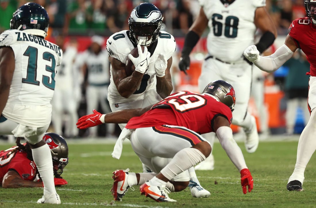 Sep 25, 2023; Tampa, Florida, USA; Philadelphia Eagles running back D'Andre Swift (0) runs with the ball as Tampa Bay Buccaneers safety Christian Izien (29) tackles during the first quarter at Raymond James Stadium. Mandatory Credit: Kim Klement Neitzel-USA TODAY Sports