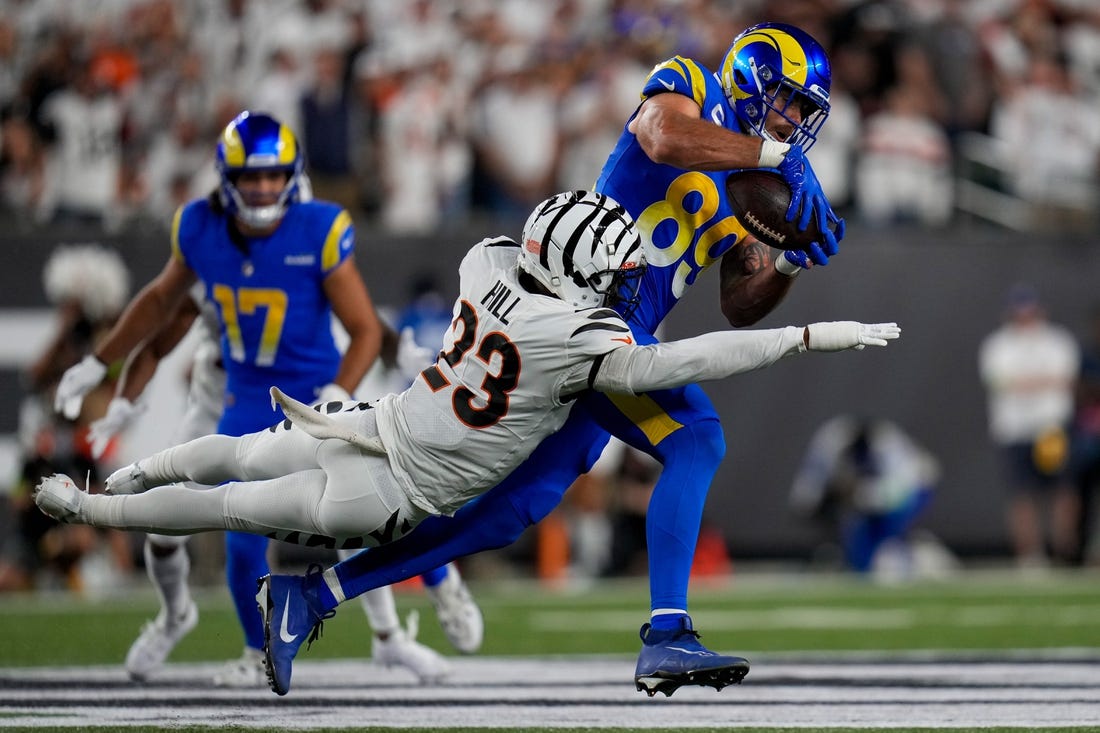 Sep 25, 2023; Cincinnati, Ohio, USA; Los Angeles Rams tight end Tyler Higbee (89) catches a pass over Cincinnati Bengals safety Dax Hill (23) in the second quarter of the NFL Week 3 game between the Cincinnati Bengals and the Los Angeles Rams at Paycor Stadium. Mandatory Credit: Sam Greene-USA TODAY Sports