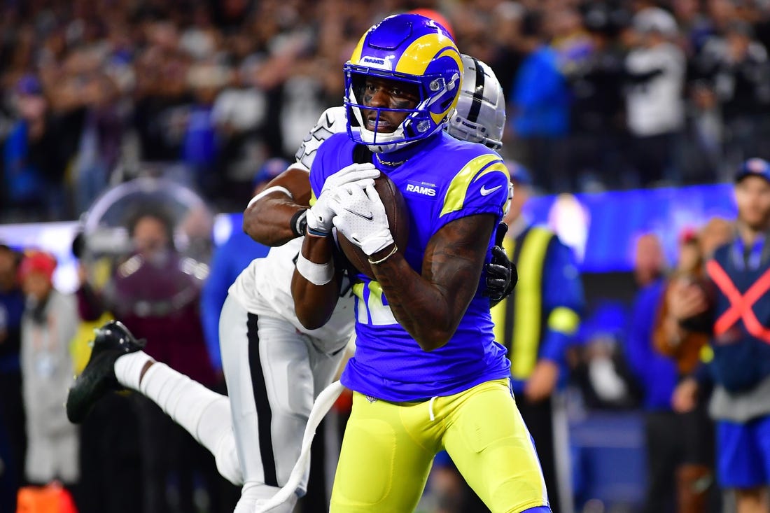 Dec 8, 2022; Inglewood, California, USA; Los Angeles Rams wide receiver Van Jefferson (12) catches a touchdown pass against the defense of Las Vegas Raiders cornerback Sam Webb (27) during the second half at SoFi Stadium. Mandatory Credit: Gary A. Vasquez-USA TODAY Sports