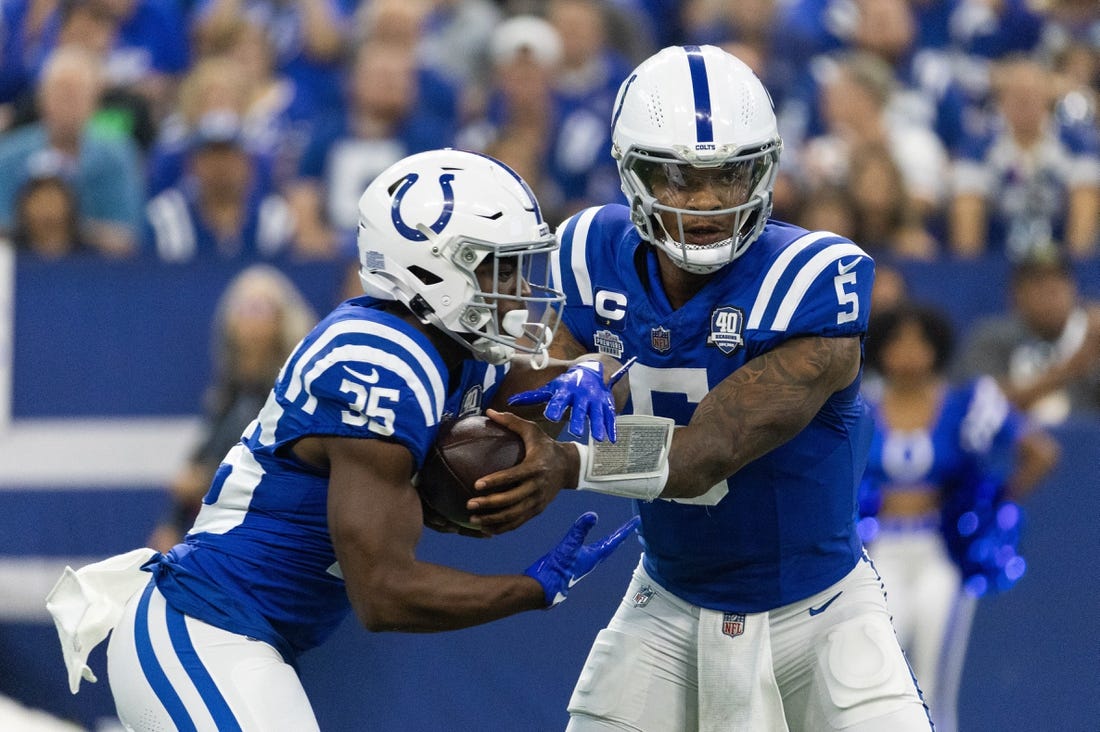 Sep 10, 2023; Indianapolis, Indiana, USA; Indianapolis Colts quarterback Anthony Richardson (5) hands the ball off to running back Deon Jackson (35)  in the first quarter against the Jacksonville Jaguars at Lucas Oil Stadium. Mandatory Credit: Trevor Ruszkowski-USA TODAY Sports
