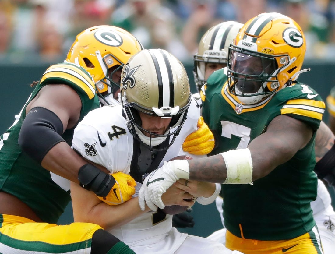 Green Bay Packers linebacker Rashan Gary (52) and linebacker Quay Walker (7) sack New Orleans Saints quarterback Derek Carr (4) during their football game Sunday, September 24, 2023, at Lambeau Field in Green Bay, Wis. The Packers defeated the Saints 18-17.
Wm. Glasheen USA TODAY NETWORK-Wisconsin