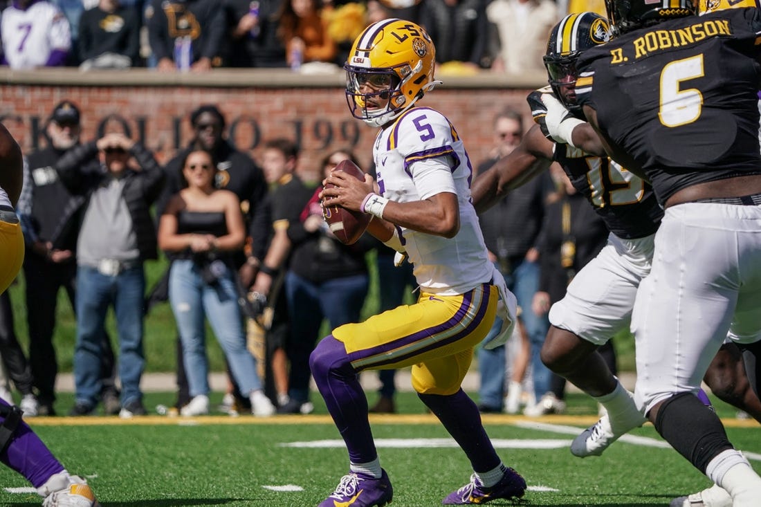 Oct 7, 2023; Columbia, Missouri, USA; LSU Tigers quarterback Jayden Daniels (5) drops back to pass against the Missouri Tigers during the first half at Faurot Field at Memorial Stadium. Mandatory Credit: Denny Medley-USA TODAY Sports