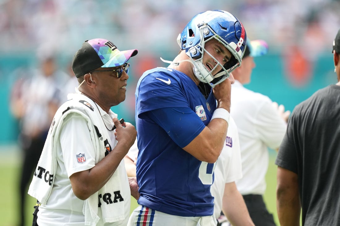 New York Giants quarterback Daniel Jones (8) leaves the game with an injury against the Miami Dolphins during the second half of an NFL game at Hard Rock Stadium in Miami Gardens, October 8, 2023.