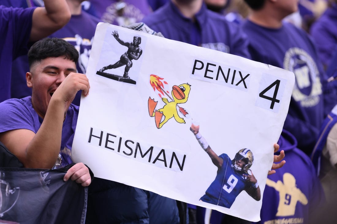 Oct 14, 2023; Seattle, Washington, USA; Fans hold up a Michael Penix Jr. (9) (not pictured) sign during the second half of the game between the Washington Huskies and the Oregon Ducks at Alaska Airlines Field at Husky Stadium. Mandatory Credit: Steven Bisig-USA TODAY Sports