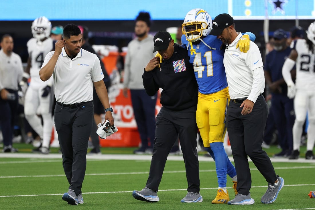 Oct 16, 2023; Inglewood, California, USA;  Los Angeles Chargers safety Raheem Layne (41) is taken out from the field during the third quarter against the Dallas Cowboys at SoFi Stadium. Mandatory Credit: Kiyoshi Mio-USA TODAY Sports
