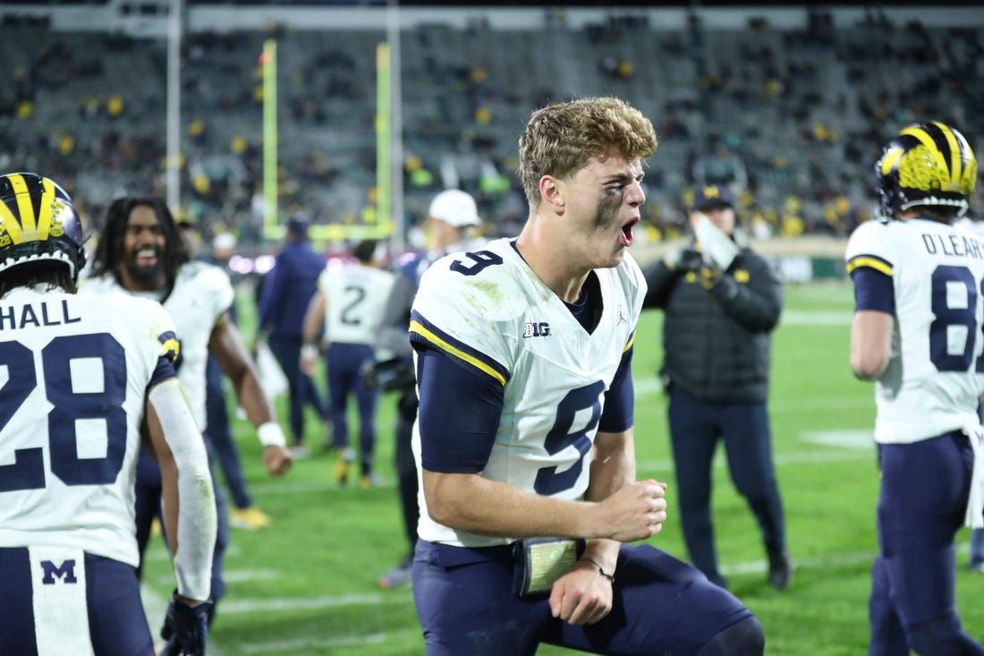 Michigan Wolverines quarterback J.J. McCarthy (9) celebrates after a touchdown against the Michigan State Spartans during second-half action at Spartan Stadium in East Lansing on Saturday, Oct. 21, 2023.