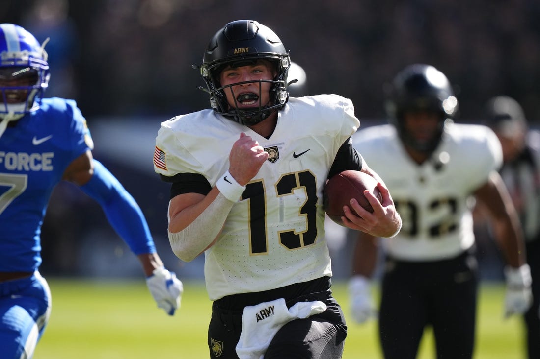 Nov 4, 2023; Denver, Colorado, USA; Army Black Knights quarterback Bryson Daily (13) carries for a 63 yard touchdown in the first quarter against the Air Force Falcons at Empower Field at Mile High. Mandatory Credit: Ron Chenoy-USA TODAY Sports